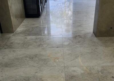 Marble floor being professionally polished by Grand Stone Restoration, Sydney, revealing a vibrant and flawless surface.